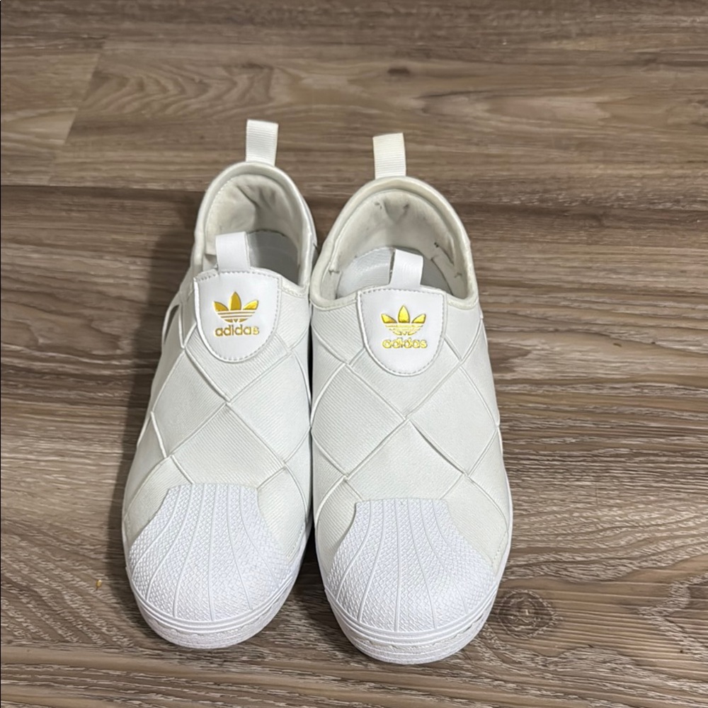 Adidas White Slip-On Sneakers with Gold Logo